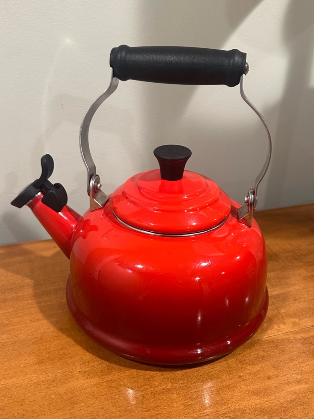 Le Creuset Red Whistling Tea Kettle with Black Handle